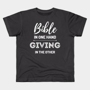 Bible in one Hand, giving in the other Kids T-Shirt